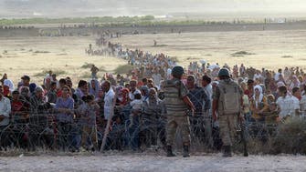 Syrian Kurds fleeing ISIS cross border into Turkey