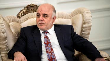 New Iraqi Prime Minister Haider Abadi listens to U.S. Secretary of State John Kerry (unseen) after a meeting in Baghdad September 10, 2014. 