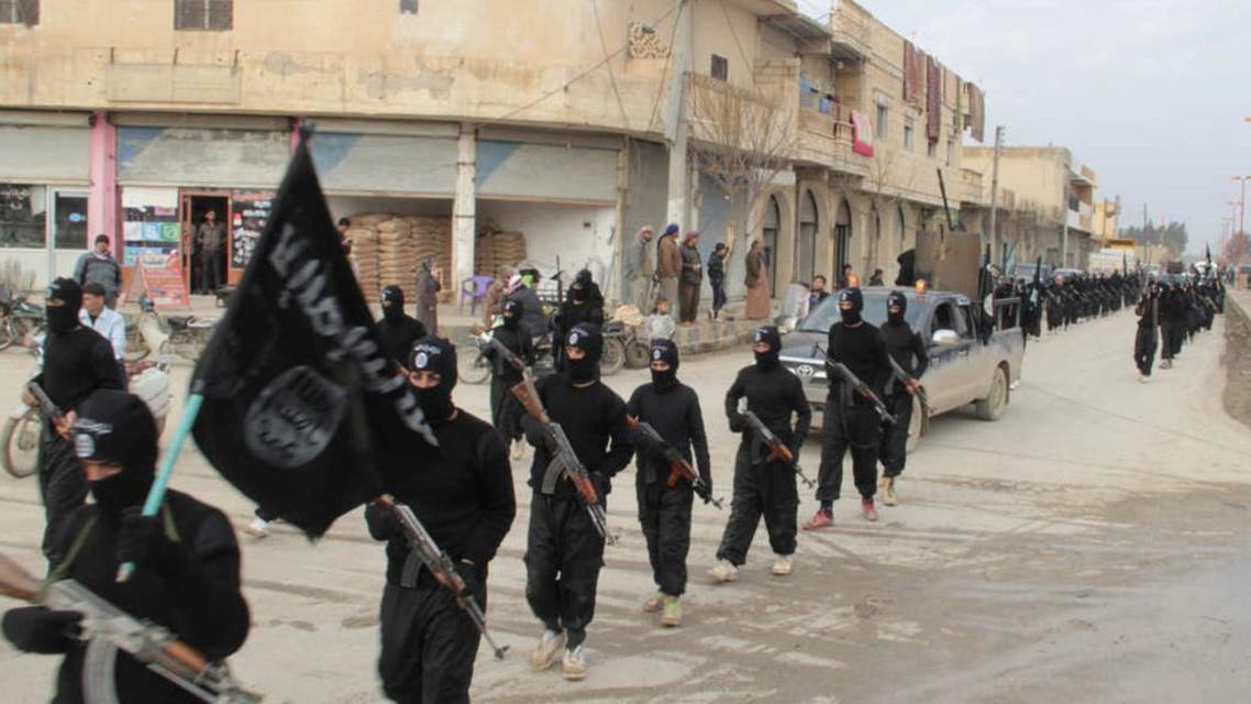 vISIS fighters parade through the Syrian town of Tel Abyad on January 2, 2014. (Reuters)