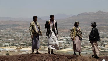 Shi'ite Houthi rebels stand on a hill at the army's First Armoured Division, after they took it over, in Sanaa September 22, 2014. (Reuters) 