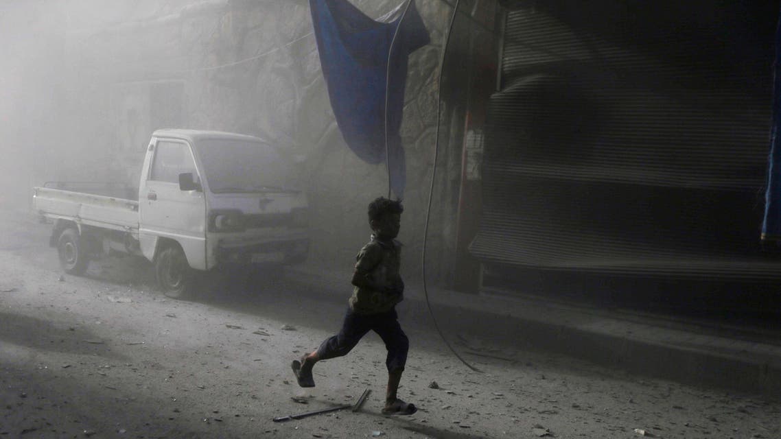 Residents carry an injured man after what activists said were two air strikes by forces of Syria's President Bashar al-Assad. (Reuters)