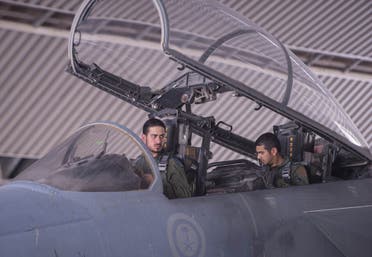 In a handout picture released by the official Saudi Press Agency (SPA), Saudi Arabian air force pilots sit in the cockpit of a fighter jet at an undisclosed location on September 23, 2014 AFP 