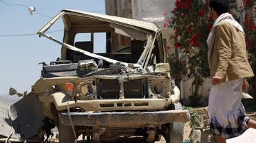  Yemeni walks past an army’s vehicle which was damaged during recent fighting between government army troops and Shiite Huthi rebels, in the capital Sanaa on September 23, 2014. Yemeni President Abdrabuh Mansur Hadi vowed to restore state authority and warned of "civil war" in the Sunni-majority country as Shiite rebels were seen in near-total control of the capital. AFP 