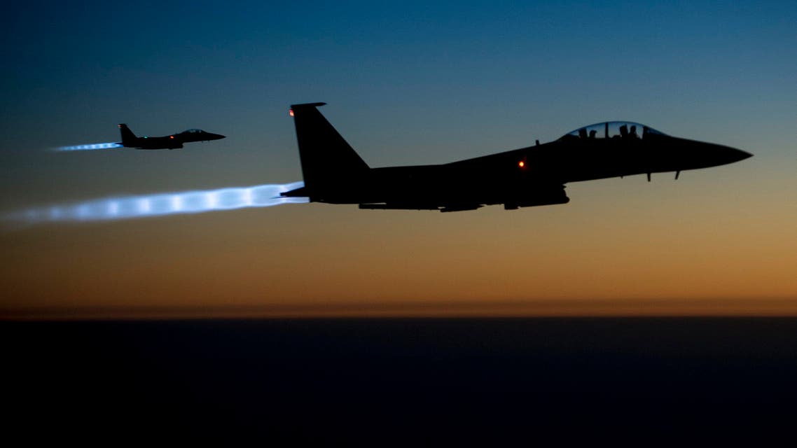 A pair of U.S. Air Force F-15E Strike Eagles fly over northern Iraq after conducting airstrikes in Syria, in this U.S. Air Force handout photo taken early in the morning of September 23, 2014. (Reuters)