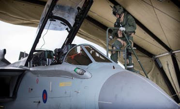 The flight crew of an RAF Tornado GR4 prepare to begin a combat mission at Akrotiri, Cyprus, in this handout image from the Ministry of Defence September 27, 2014. (Reuters)