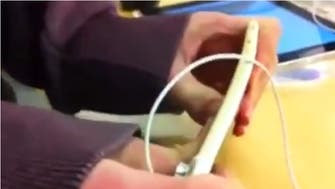 Watch shoppers try bending an iPhone 6 Plus in Apple store