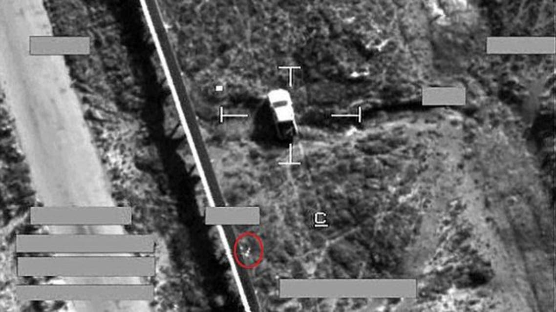 Target: This is the moment a brimstone missile from an RAF jet (circled) fell on an armed pick-up truck in Iraq during an airstrike against Islamic State fighters today