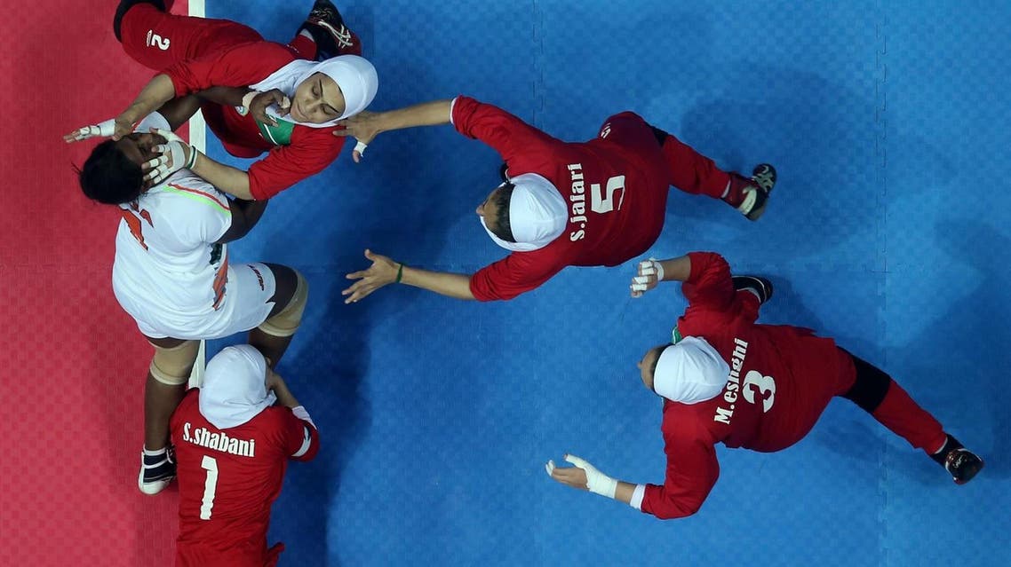 Women on the Iranian kabaddi tackle an opponent during a 2013 game. (File photo courtesy: Getty Images)