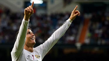 Real Madrid's Portuguese forward Cristiano Ronaldo (C) celebrates after scoring during the Spanish league football match Real Madrid vs Athletic Club Bilbao at the Santiago Bernabeu stadium in Madrid on Oct. 5, 2014. (AFP)