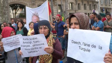 Pro-Kurdish protesters demonstrate against the threat of a "Syrian Kurdish population's genocide" by Islamic State (IS) militants and to support the population of the Syrian Kurdish town of Ain al-Arab, known as Kobane by the Kurds