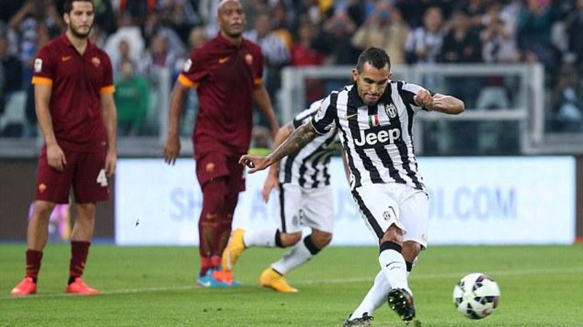 Carlos Tevez scores his first of two penalties to put Juventus into the lead in Sunday's 3-2 win against Roma Read more: http://www.dailymail.co.uk/sport/football/article-2783005/Juventus-vs-Napoli-Italian-Super-Cup-clash-played-Doha.html#ixzz3FQtwWTq5 Follow us: @MailOnline on Twitter | DailyMail on Facebook. (AFP)