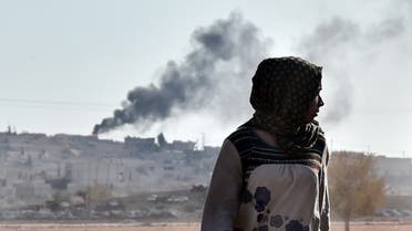 Black smoke rises during ongoing fighting in the Syrian town of Ain al-Arab, known as Kobane by the Kurds, as seen from the Turkish-Syrian border, in the southeastern town of Suruc, Sanliurfa province, on Oct. 8, 2014. (AFP)