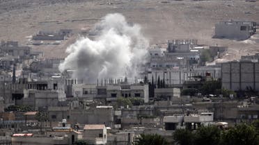 Smoke rises from the Syrian town of Kobane, seen from near the Mursitpinar border crossing on the Turkish-Syrian border in the southeastern town of Suruc, Sanliurfa province, on Oct. 3, 2014. (AFP)