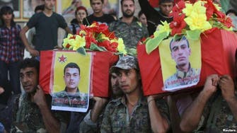 Kurds bury Kobane dead in makeshift graves over border