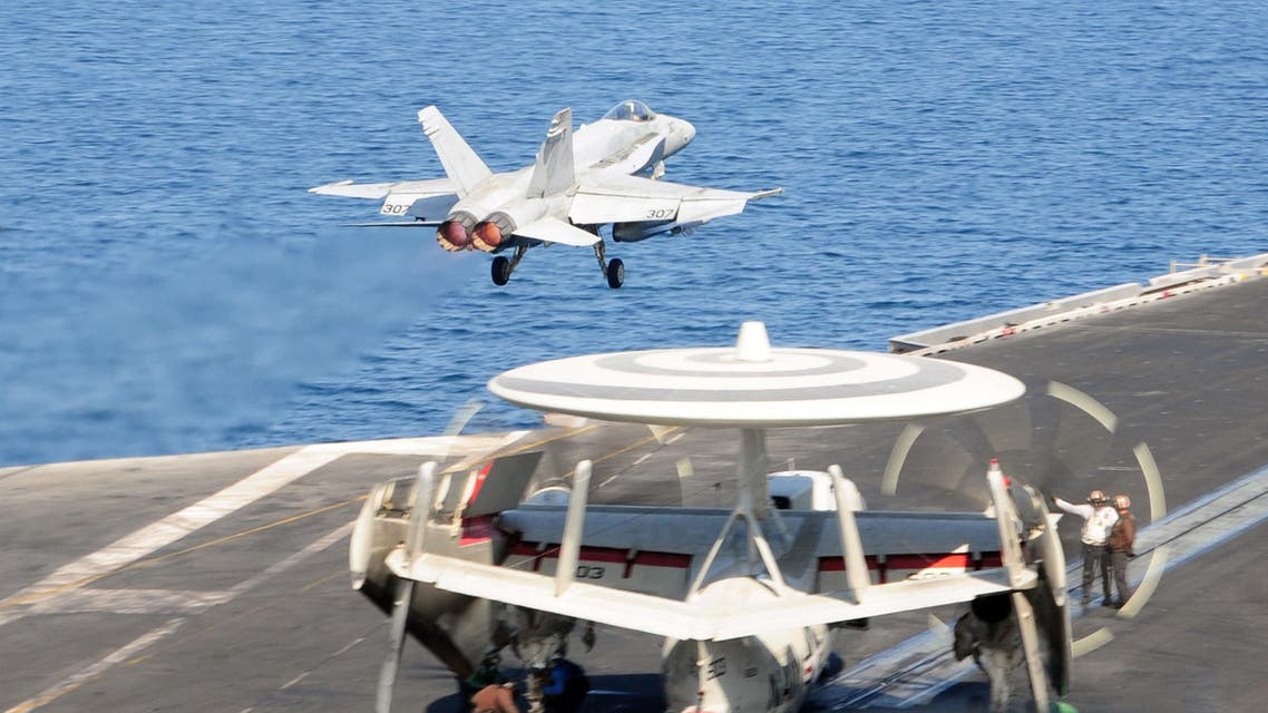 In this image released by the US Navy, an F A-18C Hornet, launches from the flight deck of the aircraft carrier USS George H.W. Bush in The Gulf on October 10, 2014. (AFP)