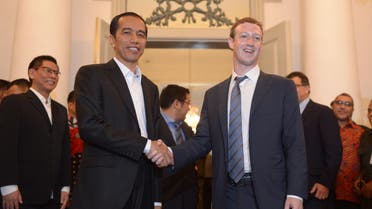 Facebook founder Mark Zuckerberg (R) shakes hand with Indonesian president-elect Joko Widodo (L) after a press conference in Jakarta on October 13, 2014. AFP