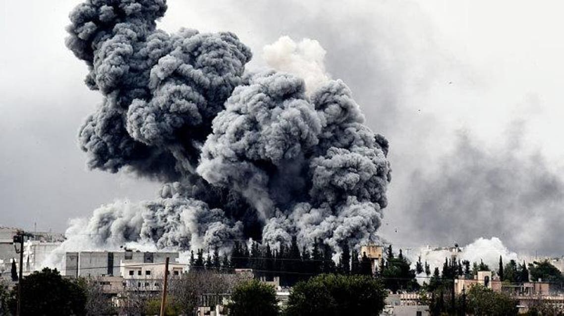 Smoke rises after a strike on Kobane as seen from the Turkish-Syrian border Photo: Saris Messinis/AFP/Getty Images