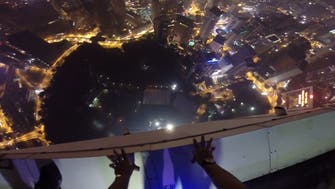 Base jumpers crash pool party in Malaysian capital