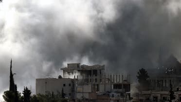 Smoke rises from the Syrian town of Ain al-Arab, known as Kobane by the Kurds. (AFP)
