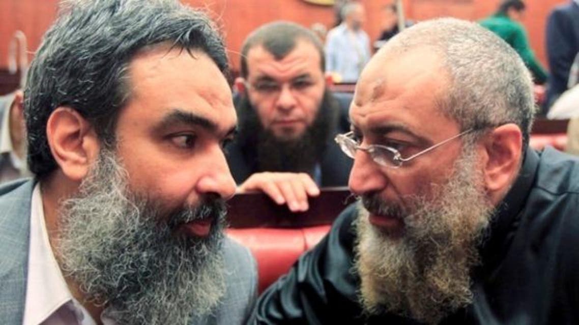 Al-Nour party member Yasser Borhami (R) speaks with Bassam al-Zarqa, one of the advisers to then President Mohammad Mursi, at the Shura Council during the final vote on a draft new Egyptian Constitution, Nov. 29, 2012. (Reuters)