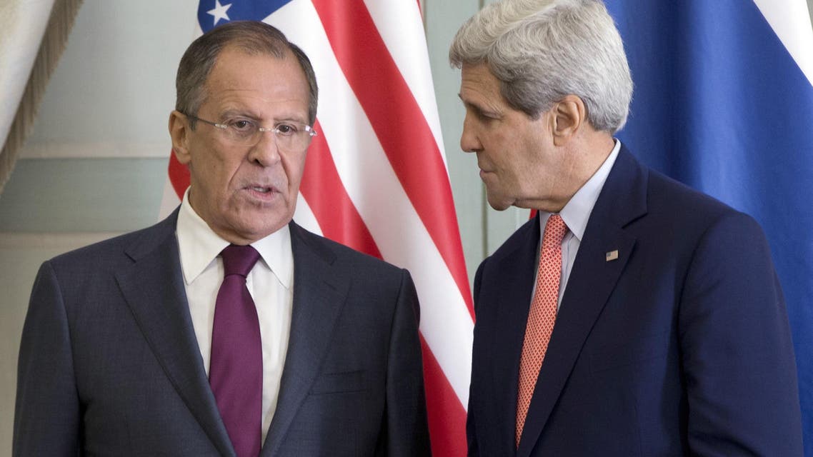 US Secretary of State John Kerry (R) speaks with Russian Foreign Minister Sergei Lavrov during a meeting at the Chief of Mission Residence in Paris on Oct. 14, 2014. (AFP)