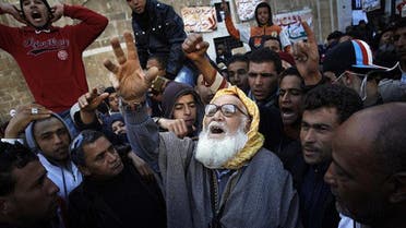 A man from rural Tunisia takes part in a demonstration in front of the prime minister's office in the capital, Tunis