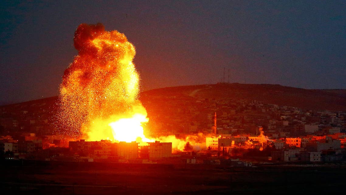 Smoke and flames rise over Syrian town of Kobane after an airstrike, as seen from the Mursitpinar border crossing on the Turkish-Syrian border. (Reuters)