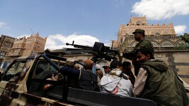 Shi'ite Houthi militants patrol the vicinity of a venue where a mass funeral for victims of a suicide attack on followers of the Shi'ite Houthi group was being held in Sanaa October 14, 2014. (Reuters)