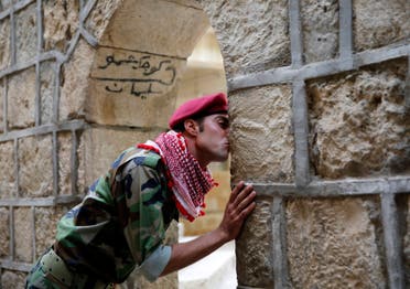 A displaced fighter from the minority Yazidi sect, who fled the violence in Sinjar, worships at their main holy temple Lalish in Shikhan. (Reuters)