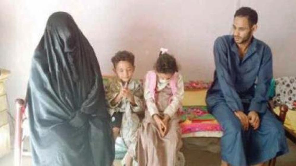 Um Hasan with some of her children, including her elder son. — Courtesy Al-Hayat