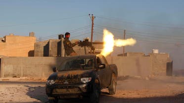 A fighter from armed group Operation Dawn fires a weapon during clashes with rival group the Zintan brigade, on the outskirts of the city of Kklh, southwest of Tripoli October 21, 2014.  (Reuters)