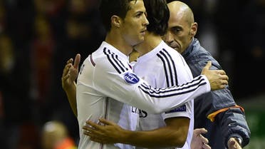 Real Madrid's Portuguese forward Cristiano Ronaldo (L) embraces Real Madrid's German midfielder Sami Khedira (R) as he is substituted during the UEFA Champions League, group B, football match between Liverpool and Real Madrid at Anfield in Liverpool, northwest England, on October 22, 2014. AFP