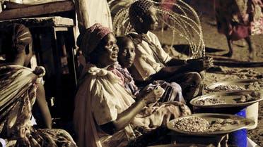 South Sudanese internally displaced people (IDP) sell food at the United Nations Mission in South Sudan (UNMISS) camp in Malakal on Oct. 16, 2014. (AFP)