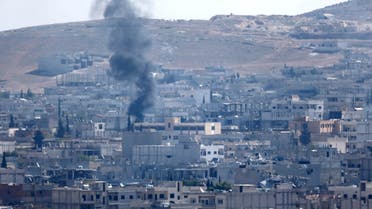 Smoke rises over the Syrian town of Kobane near the Mursitpinar border crossing, on the Turkish-Syrian border, as seen from the southeastern town of Suruc in Sanliurfa province October 24, 2014. (Reuters)
