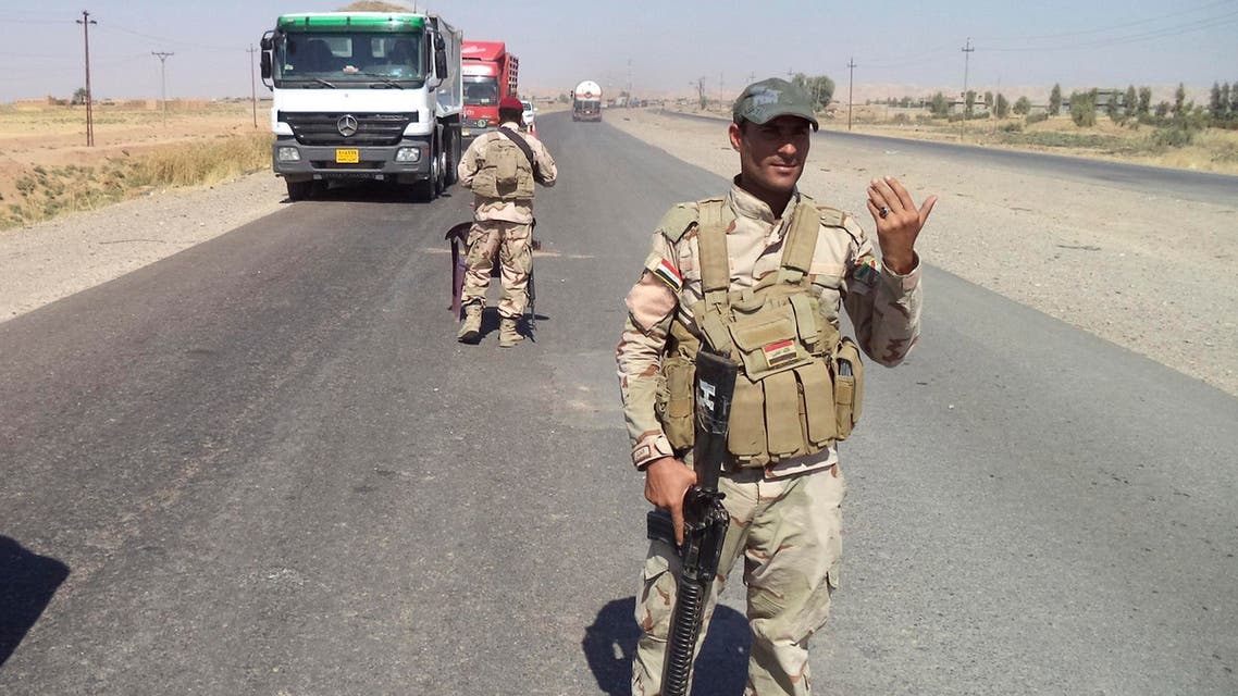raqi soldiers stand guard at a checkpoint on the outskirts of Tikrit, northern Iraq October 8, 2014. Picture taken Oct. 8, 2014. (AFP)