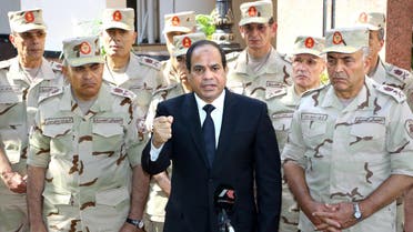 Egypt's President Abdel Fattah al-Sisi (C) seen surrounded by top military generals, addresses journalists following an emergency meeting of the Supreme Council of the armed Forces in Cairo. (AFP)