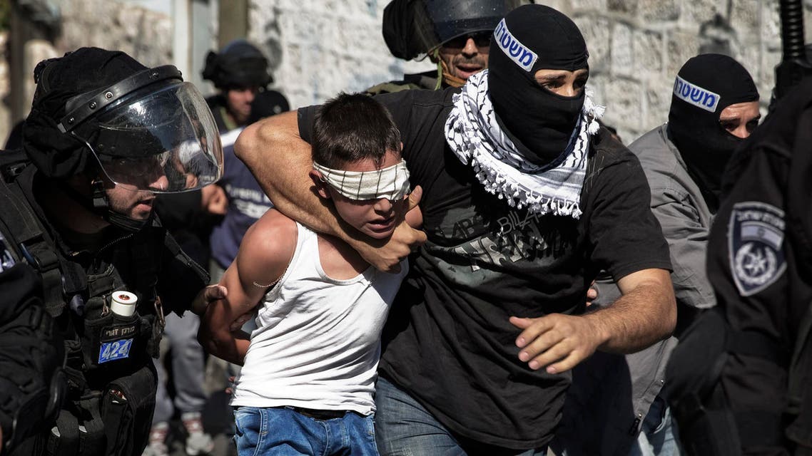Israeli police detain a Palestinian youth following clashes after Friday prayers in the East Jerusalem neighbourhood of Wadi al-Joz October 24, 2014. (Reuters)