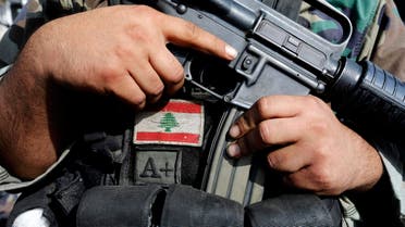 A Lebanese army soldier holds his weapon after being deployed to tighten security, following clashes between Lebanese soldiers and Islamist gunmen in Tripoli, northern Lebanon October 27, 2014. (Reuters)