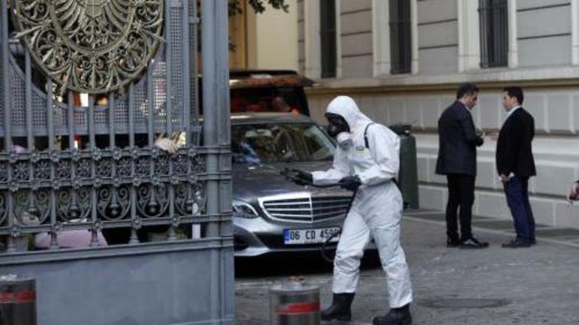 A member of Turkey's disaster management agency disinfects the garden of the German consulate in Istanbul October 24, 2014. (Reuters)