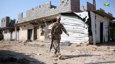  An Iraqi soldier walks in Jurf al-Sakhr on October 27, 2014 after Iraqi military forces retook the large area south of the capital from ISIS. (AFP)