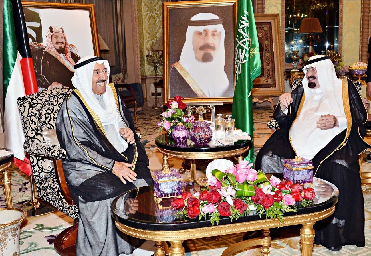 Then-Saudi Arabian King Abdullah (right) with visiting Kuwait emir, Sheikh Sabah al-Ahmad al-Sabah, in 2014. (SPA)