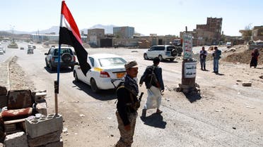 Yemeni gunmen loyal to the Shiite Houthi movement man a checkpoint in Sanaa. (AFP)