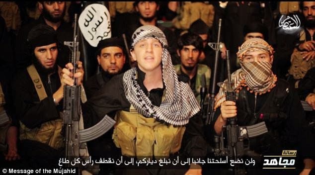 Australian boy Abu Khaled, believed to be Abdullah Elmir, speaks flanked by other ISIS jihadists in a recent ISIS propaganda video.