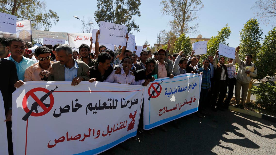 Students hold banners to demonstrate against the deployment of armed Houthi gunmen, at Sanaa University campus in Sanaa October 29, 2014. (Reuters)