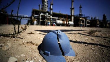 A worker's helmet lies on the ground at the Zawiya oil refinery, some 40 kms west of Tripoli. afp