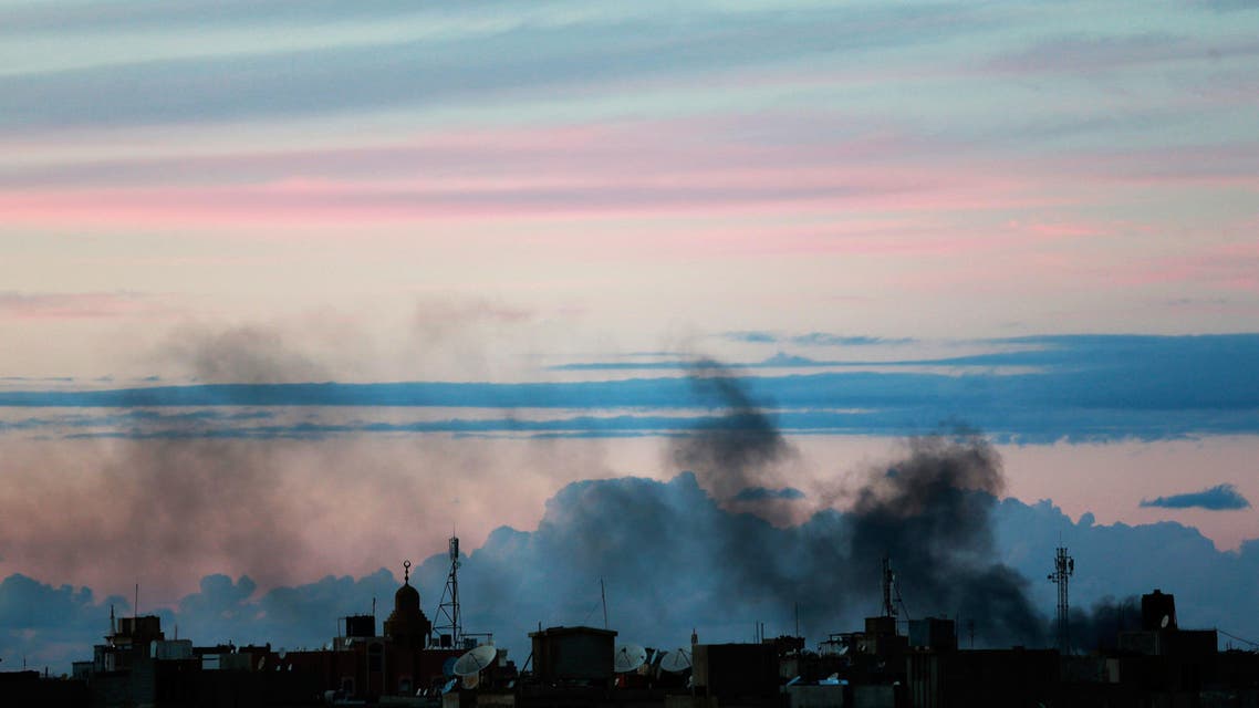 Black smoke billows in the sky above areas where clashes are taking place between pro-government forces, in Benghazi October 31, 2014. (Reuters)