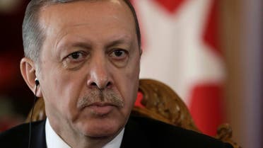 Turkey's President Recep Tayyip Erdogan listens during a news conference in Riga October 23, 2014. (Reuters)