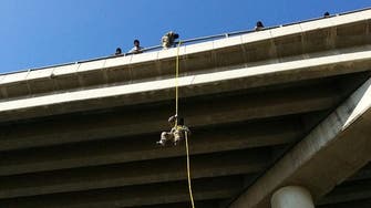 ISIS fighters abseil from Mosul bridge into heavy traffic