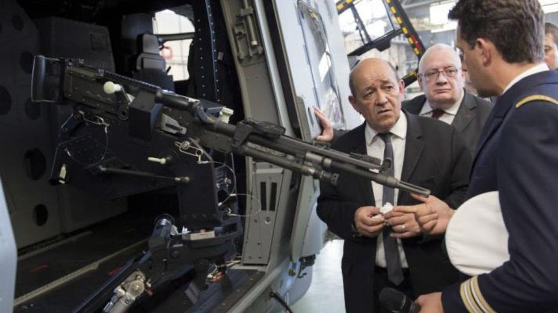 French Defence Minister Jean-Yves Le Drian inspects a weapons procurement agency last June AFP