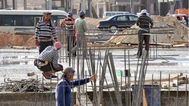 Foreign laborers work at a construction site in the Saudi capital Riyadh. AFP